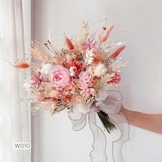 a person holding a bouquet of flowers in front of a white wall and window sill