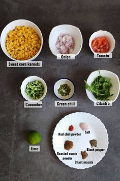 the ingredients for this meal are shown in bowls and on plates, including tomatoes, corn, broccoli, green chili, red pepper, black pepper, lime