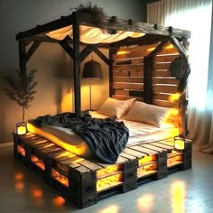 a bed made out of pallets with lights on the sides and pillows under it