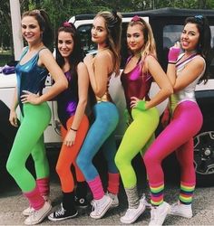 the girls are posing in their colorful outfits