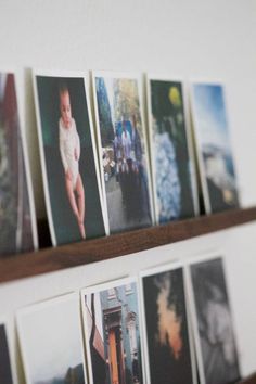 several photographs are hanging on the wall