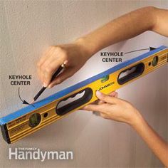 a person is measuring the length of a wall with a tape measure tool and an ad for keyhole center