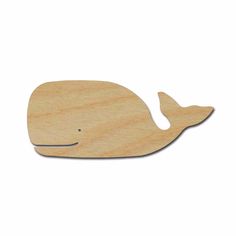 a wooden whale cutout on a white background