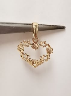 "Thanks for shopping our vintage estate store. We tend to sell well below wholesale and truly hope you enjoy all of our items. Many of the items are one of a kind, so please enjoy scrolling through the pictures and hopefully something will catch your eye. Estate 14k yellow gold Victorian heart flower pendant detailed beading. We also have listed ring that matches this pendant in another listing G12. Pendant Size: 3/4\" by 5/8\" Bail: 3mm Weight: 0.61 gram Marked 14k gold and is a beautiful penda Vintage Heart Pendant, Fantasy Earrings, Gold Heart Pendant, Antique Gold Jewelry, Heart Flower, Jewelry Accessories Ideas, Dope Jewelry, Funky Jewelry, Jewelry Lookbook