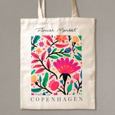 a tote bag with an image of flowers on it