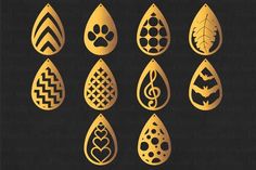 the different types of water drop designs in gold and black, each with an animal's paw print on it