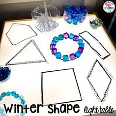 the table is covered with different types of beads and bracelets for winter shape activities