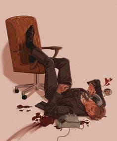 a man laying on the ground next to an office chair with blood all over it