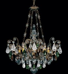 a chandelier with many crystal drops hanging from it's arms and sides