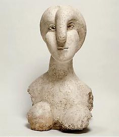 a sculpture of a woman's head with her eyes closed