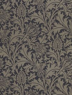 an old fashioned wallpaper pattern with black and grey flowers on the back ground,