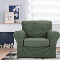 a green chair sitting in front of a window with blinds on top of the windowsill