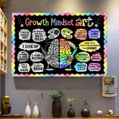 a bulletin board on the wall in a room with vases and potted plants