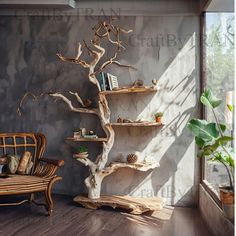 a wooden shelf with books on it next to a chair and a tree in the corner