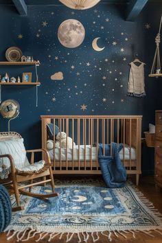 a baby's room with blue walls and stars on the ceiling