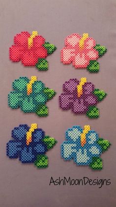 some flowers made out of perler beads are on the screen, and there is an instagramr