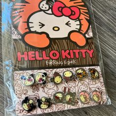 the hello kitty earrings are in plastic packaging