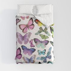 a bed with butterflies printed on it