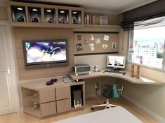 a computer desk with a monitor, keyboard and mouse on it in front of a window