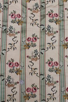 an old fashioned wallpaper with flowers and stripes on white background, as well as green stripeing