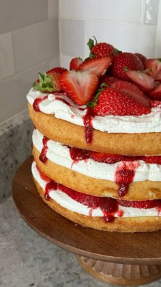 there is a cake with strawberries on top