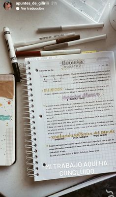 an open notebook sitting on top of a table