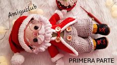 two knitted santa claus dolls laying next to each other