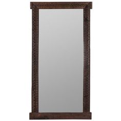 a large mirror sitting on top of a wooden frame