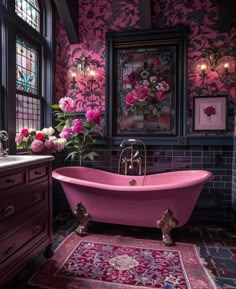 a pink bath tub sitting in a bathroom next to a window with flowers on it