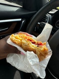 A hand holding a Dunkin’ bacon, egg, and cheese croissant sandwich inside a car Bacon Egg And Cheese Croissant, Egg Cheese Croissant, Egg And Cheese Croissant, Breakfast Vibes, Bacon Egg Cheese, Best Breakfast Sandwich, Cheese Croissant, Good Breakfast