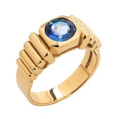 Handcrafted in Italy in 18 karat gold, inspired by a mix of Art Deco influences and Incan motifs, this elegant ring is the perfect jewel to add to your everyday attire - combining originality, quality and style! 18 karat Yellow Gold approx 10gr 1 round brilliant Tanzanite 1.55ct Handcrafted in Italy Modern Yellow Gold Sapphire Ring For Formal Events, Modern Yellow Gold Sapphire Ring For Formal Occasions, Luxury Emerald Ring With Tension Setting, Modern Emerald Ring With Center Stone, Modern Yellow Gold Topaz Ring With Polished Finish, Modern Topaz Ring With Center Stone In Yellow Gold, Modern Yellow Gold Sapphire Ring With Center Stone, Modern Yellow Gold Topaz Ring With Center Stone, Unique Yellow Gold Topaz Ring For Formal Occasions