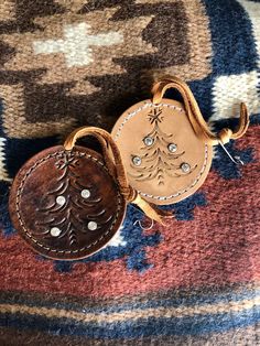 a brown leather purse sitting on top of a rug