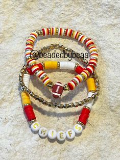 three bracelets with beads and letters on them