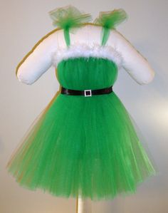 A handmade green Mrs. Claus dress made with tons of tulle to create maximum fullness and coverage. Perfect for Christmas!    The tutu dress is Mrs Claus Dress, Christmas Tutu Dress, Christmas Tutu, Flowing Dress, Girls Costumes, Custom Gift Wrapping, Hand Stitch, Flowing Dresses, Mrs Claus