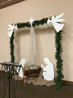 a nativity scene with angels and baby jesus