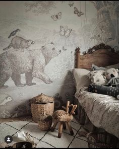 a bed room with a neatly made bed and stuffed animals