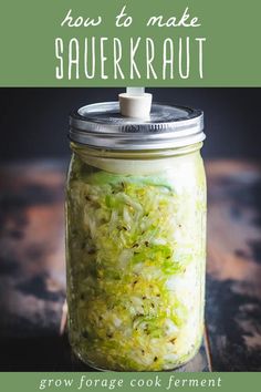 a mason jar filled with sauerkraut on top of a wooden table