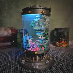 a fish tank with an underwater scene on it's side sitting on top of a table