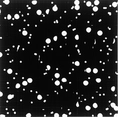 an abstract black and white photo with lots of circles on it's surface,