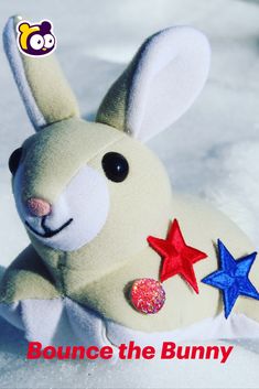 a stuffed animal rabbit with stars on its chest and the words bounce the bunny above it