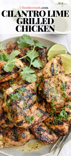 grilled chicken with cilantro and lime garnish on a plate