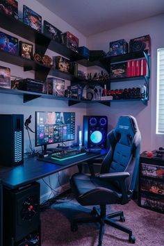 a computer desk with two monitors and a gaming chair in front of it on top of a carpeted floor