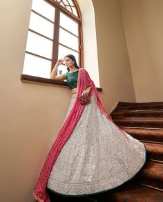 Off White Heavy Mirror Embroidered Lehenga. This lehenga choli has Sequence, Gota, Mirror, Resham Embroidery, Printed. It comes with a Grey Georgette Blouse and Pink Chinon Silk dupatta. #white#green#pink#handpurse#jwellory#ring#whitelahnga#lahnga#black#fashion#stylish#unique#red#pinkchunni#eyering#white Heavy Anarkali, Anarkali Lehenga Gowns, Mirror Work Dress, Partywear Lehenga, Indian Wedding Lehenga, Resham Embroidery, Lehenga Suit, Party Wear Lehenga Choli, Anarkali Lehenga