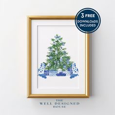 a blue and white christmas tree in a gold frame