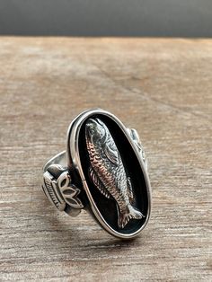 This ring was made from solid sterling and fine silver. A realistic fish is framed in an oval and flanked by stamped designs. This ring is a size 7 Rings Homemade, Fish Rings, Fish Ring, Fish Jewelry, Art Ring, Bold Rings, Fishing Theme, Ancient Jewelry, Fish Art