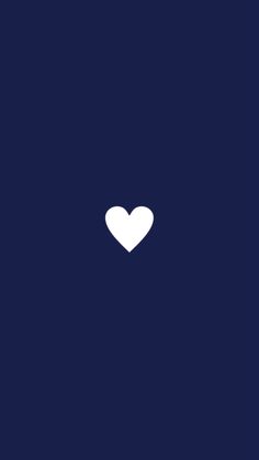 a white heart on a dark blue background