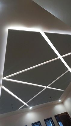 the ceiling is decorated with white lines and lights