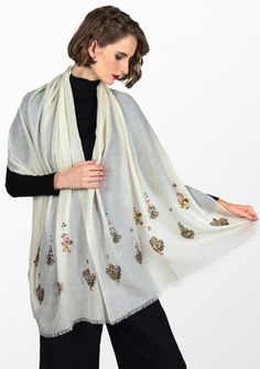 Woven from a very fine cashmere, this elegant ivory scarf is elevated by a hand-embroidered earings design in metallic beads from both ends. Incredibly stylish and comfortably warm for year-round wear, this scarf can be styled in many eye-catching ways, especially as an exclusive accessory to a wedding gown. Luxury Embroidered Scarves For Eid, White Festive Pashmina Shawl, White Pashmina Shawl For Festive Occasions, Festive White Pashmina Shawl, Elegant Pashmina Shawl With Intricate Embroidery For Festive Occasions, White Embroidered Pashmina Scarf, Traditional White Scarves For Winter, Traditional White Winter Scarves, Elegant Cream Scarves For Festive Season