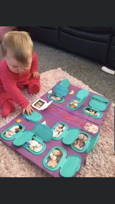 a toddler playing with an activity tray on the floor