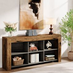 a wooden shelf with books and vases on it